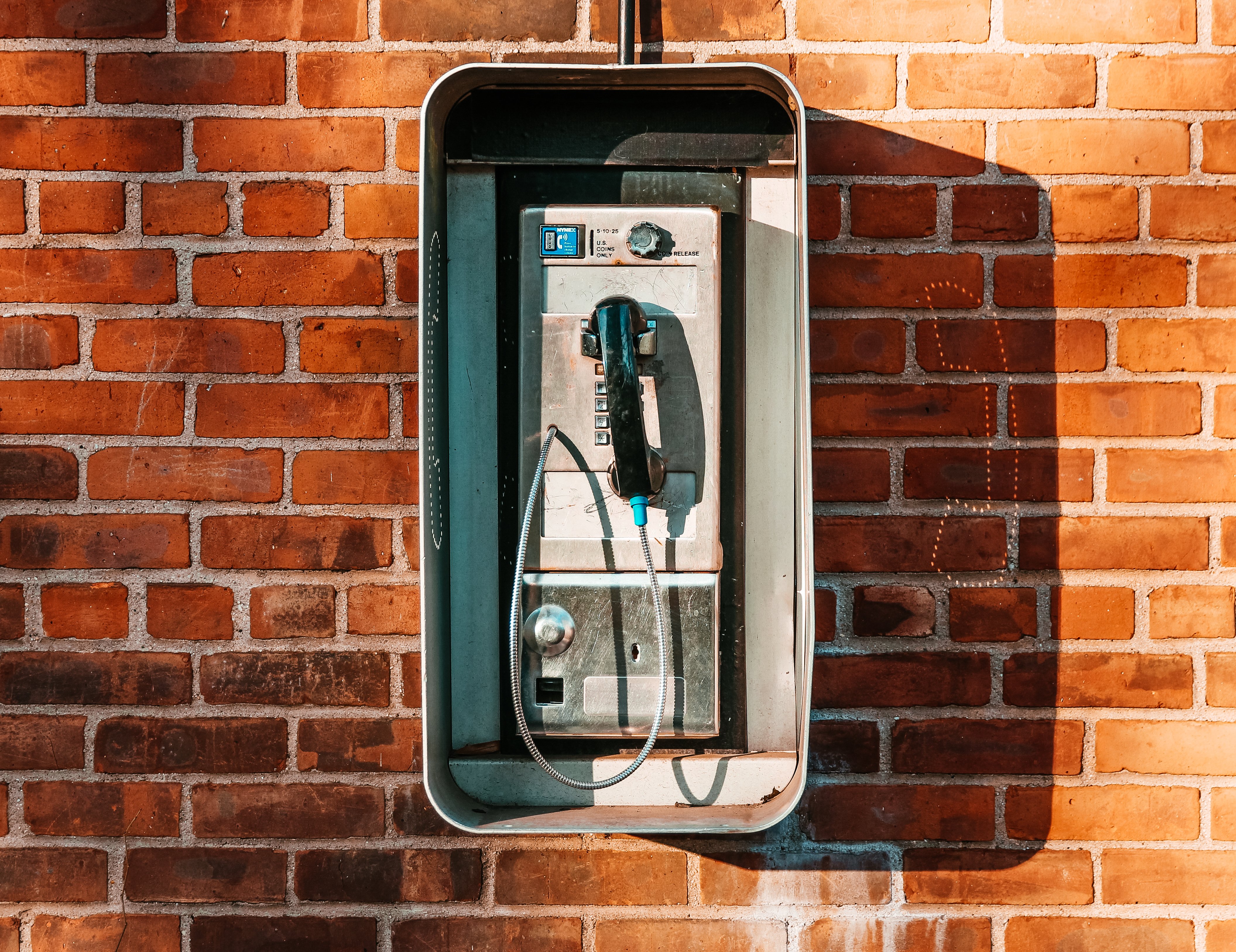 payphone-on-brick-wall_4460x4460